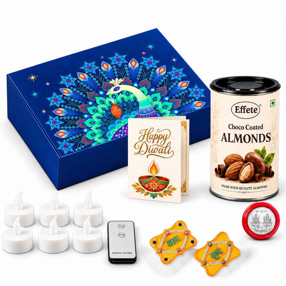 A blue peacock-themed gift box, choco almonds, six LED tealights, remote, two yellow Shubh-Labh decorations, and a silver