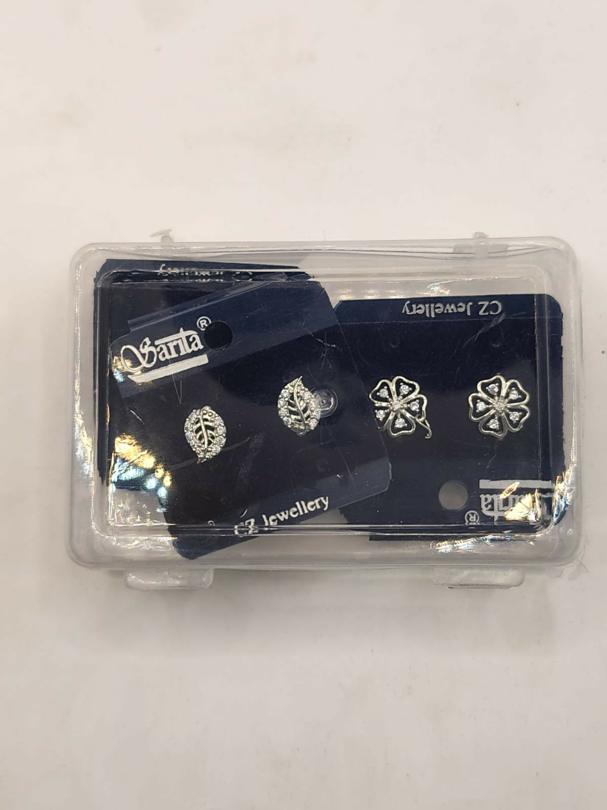 Elegant diamond-style stud earrings set featuring floral, leaf and scroll designs