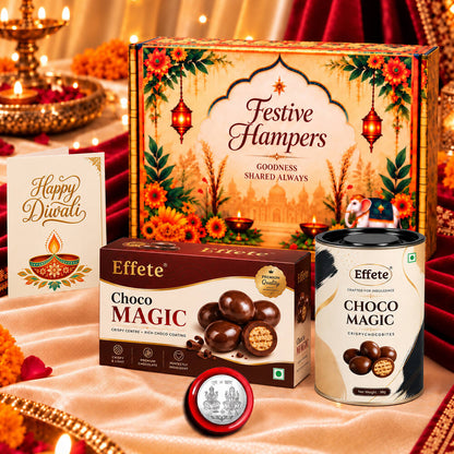 A festive gift box, chocolate box, canister, greeting card, and silver coin on a peach cloth.