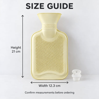 A light yellow hot water bottle with measurements indicating a height of 21 cm and a width of 12.3 cm.