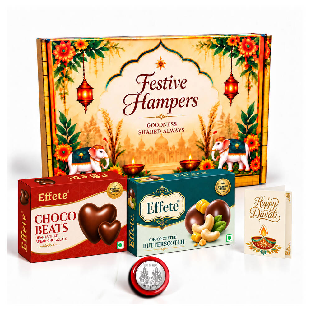 A festive hamper box with two Effete chocolate boxes, a silver coin, and a Happy Diwali card.
