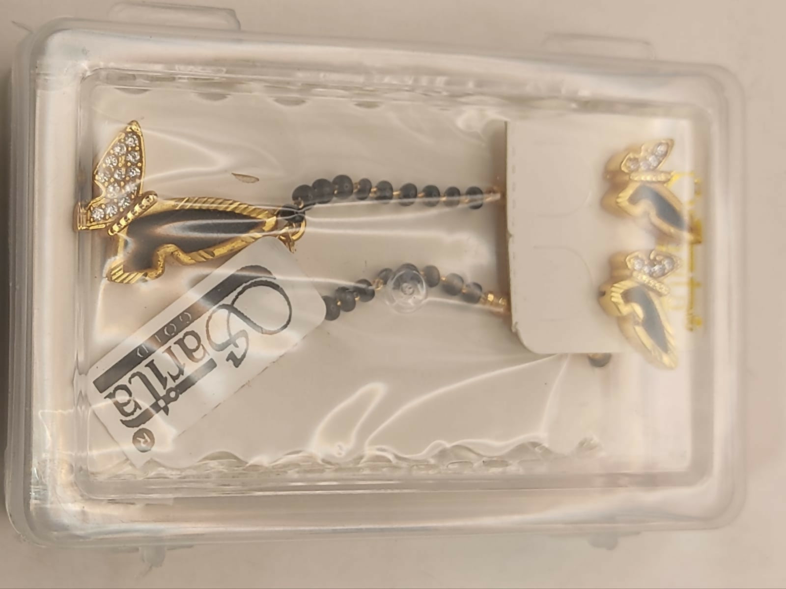 Complete gold-plated butterfly mangalsutra set displayed on a fabric background
