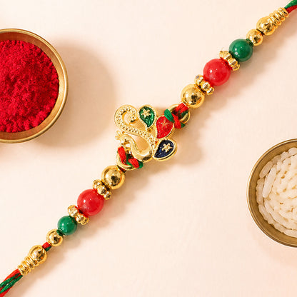 Colorful Enamel Peacock Pendant Rakhi with Red and Green Beads