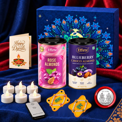 A dark blue box, two tins of almonds, a Diwali card, six white LED tealights, a remote, and two yellow Shubh-Labh