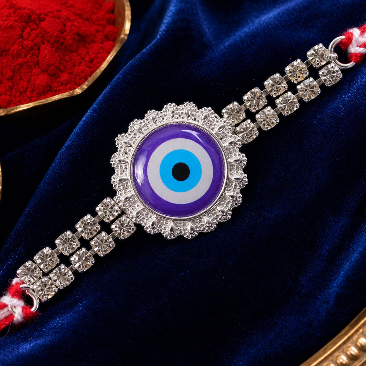 Premium Rakhi showcasing Evil Eye Charm, leaf touch and thread look for Gift Use