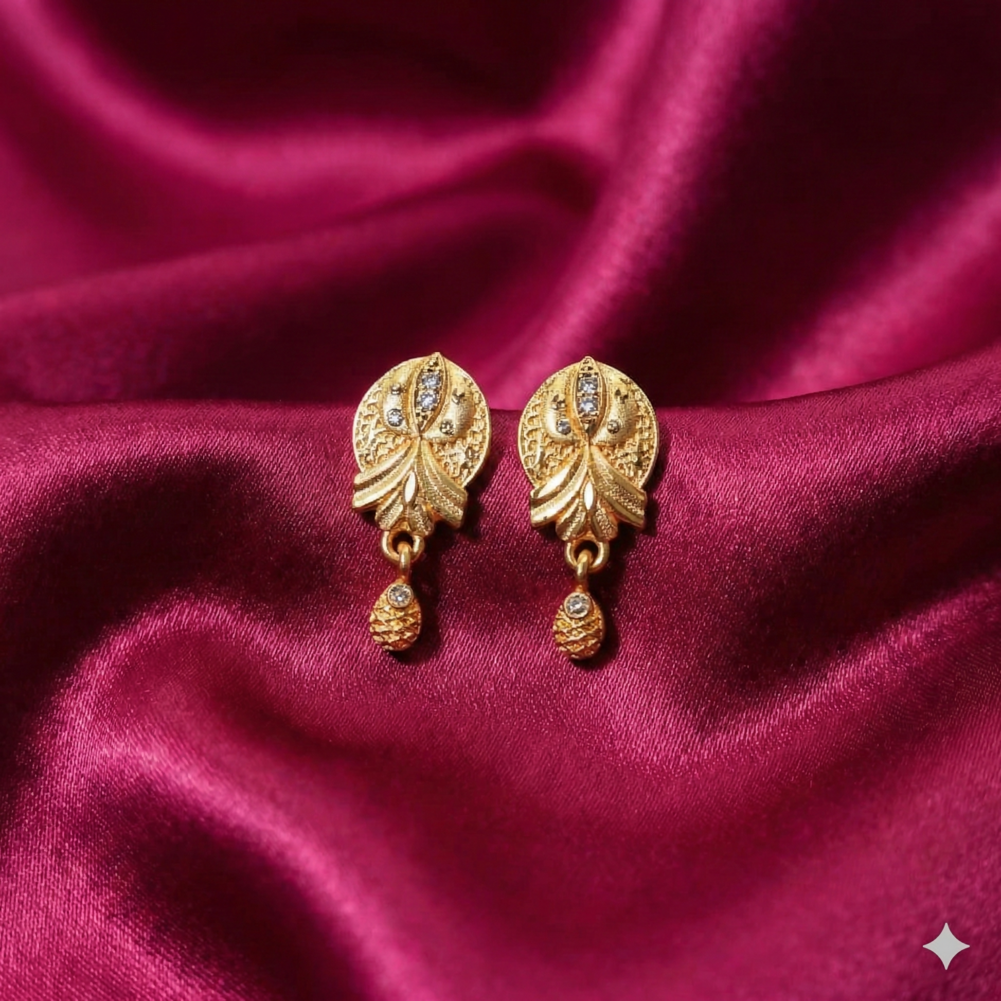 Gold plated floral drop earrings with matte finish and AD accents front view