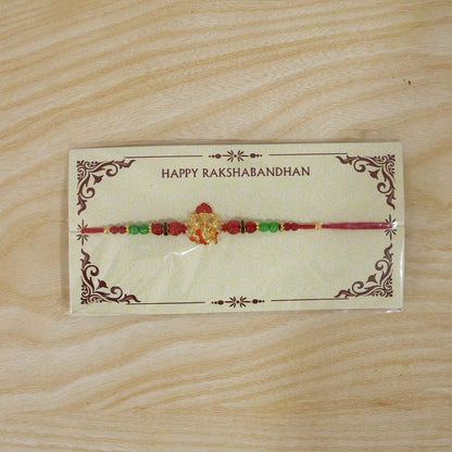 Antique golden Rakhi with designer elements and beads
