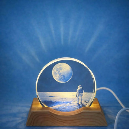 Close-up of moon and astronaut design on acrylic lamp