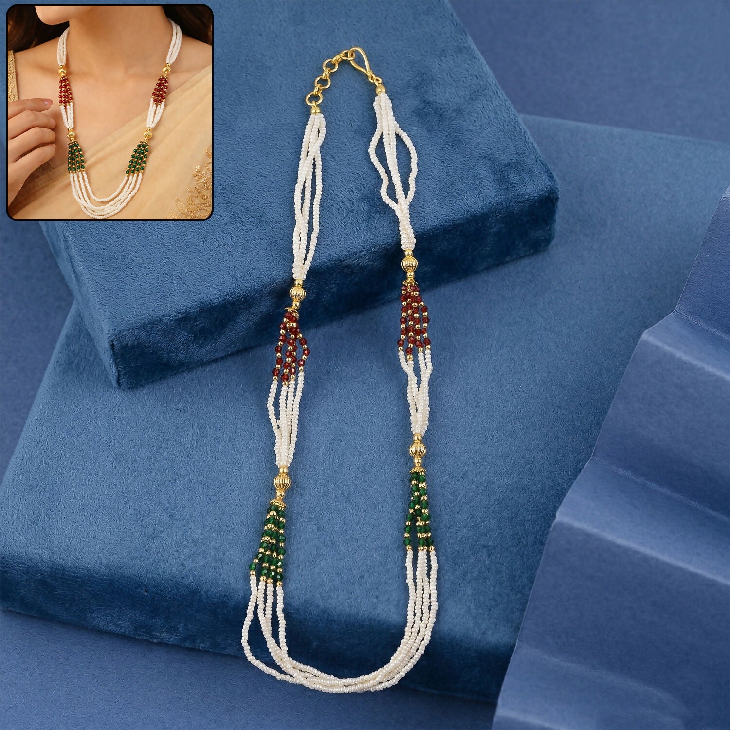 Traditional white multi-strand beaded mala necklace with red and green accents