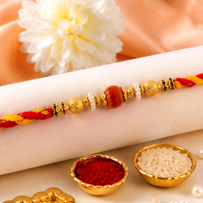 Beautiful Pearl Bead Rakhi with Soft Festive Shades and Elegant Designer Look
