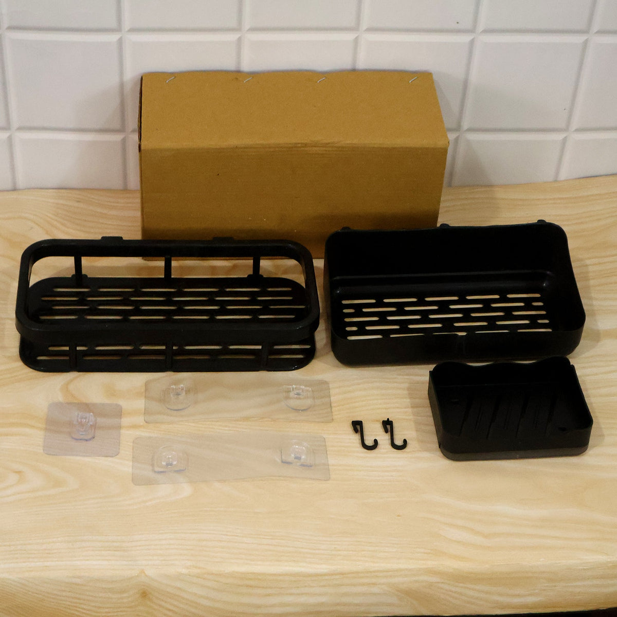 Packaging for the black plastic bathroom shower caddy set