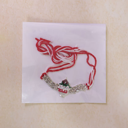 Festive Rakhi showcasing Kalash Charm, leaf detail and wrist style for Festive Use