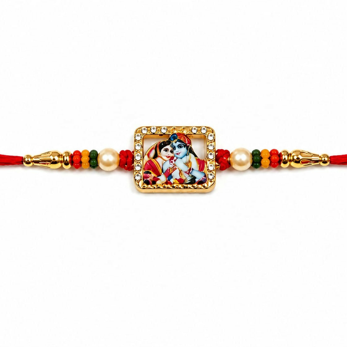 A close-up of the red thread bracelet shows a gold-toned square Radha Krishna charm with a crystal border and pearl accents.