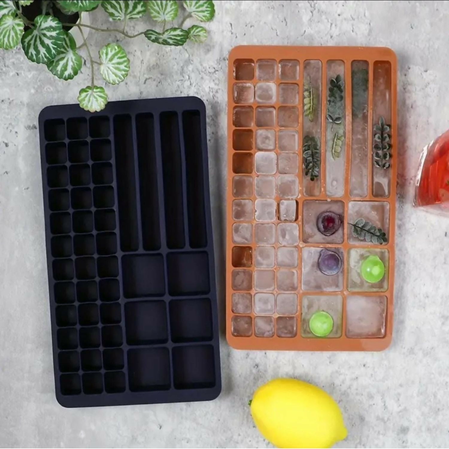 Stacked multi-shape ice trays in bright green color