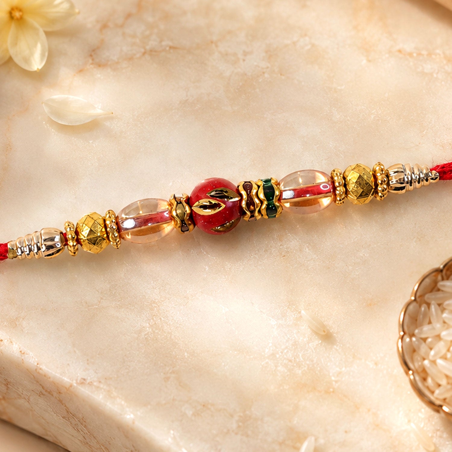 Red Enamel Golden Designer Rakhi with Transparent Beads and Rich Festive Shine