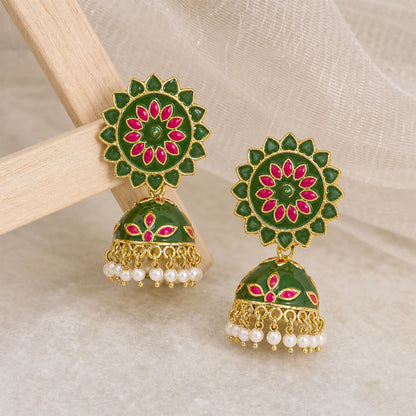 Side view of mahendi and pink floral jhumka earrings