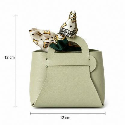 Mini handbag style organizer on a desk for cosmetics