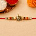 Red Thread Rakhi with Antique Gold Turtle Pendant and Beaded Accents