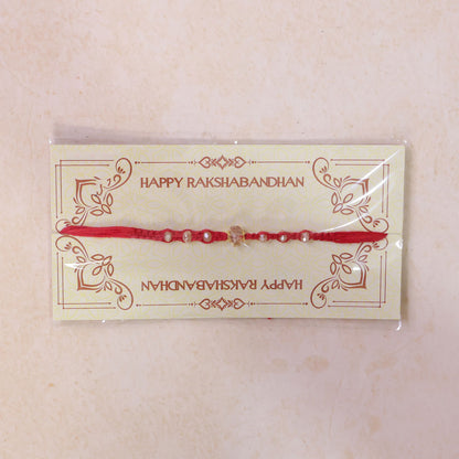 Red Beaded Rakhi with Champagne Crystal Bead and Red Bead Accents
