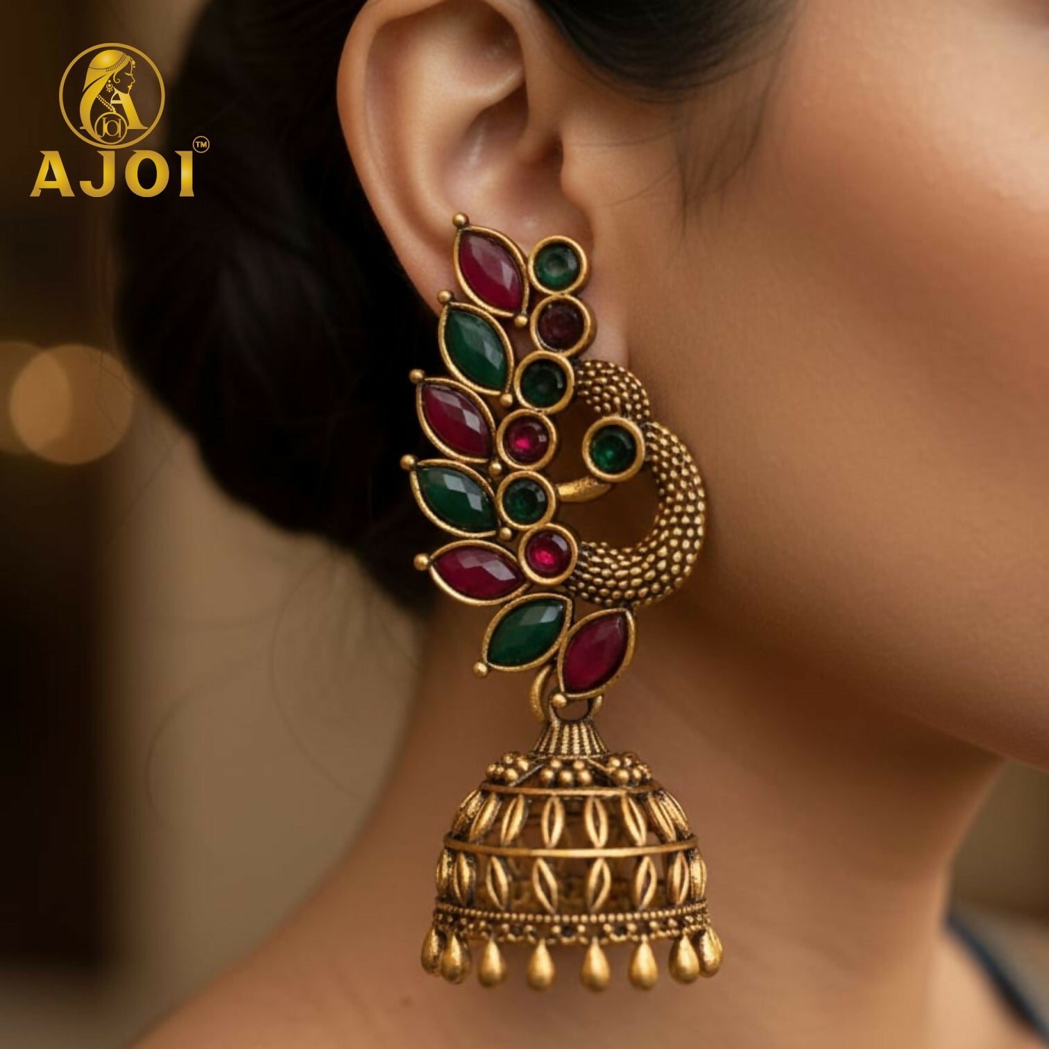 Close-up view of peacock and floral detailed oxidized silver and antique gold earrings combo