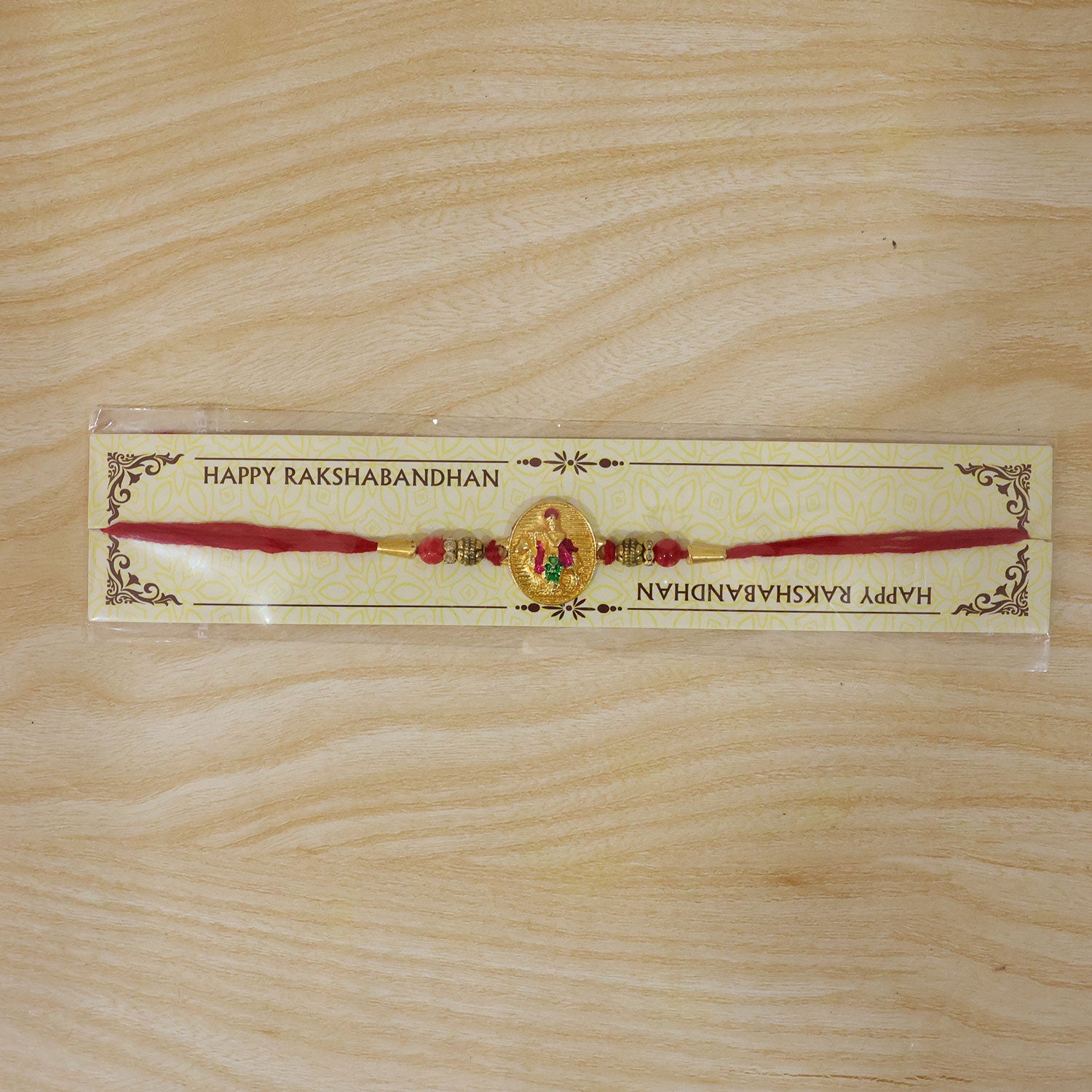 Dwarkadhish Krishna Gold Coin Rakhi with Red Beads