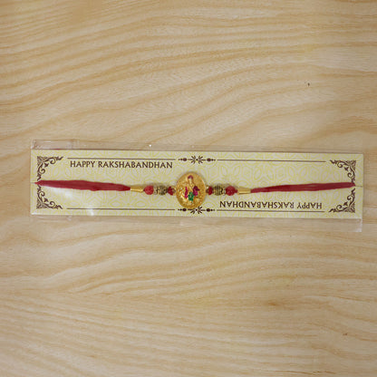 Dwarkadhish Krishna Gold Coin Rakhi with Red Beads