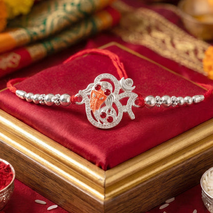 Silver Om Ganesh Rakhi with Red Stones and Metal Bead Chain