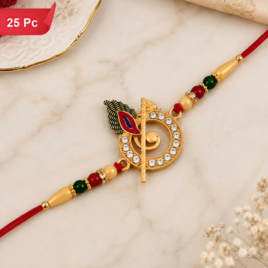 A gold-colored Krishna flute and peacock feather design, studded with clear stones and red, green, and cream beads, on a red