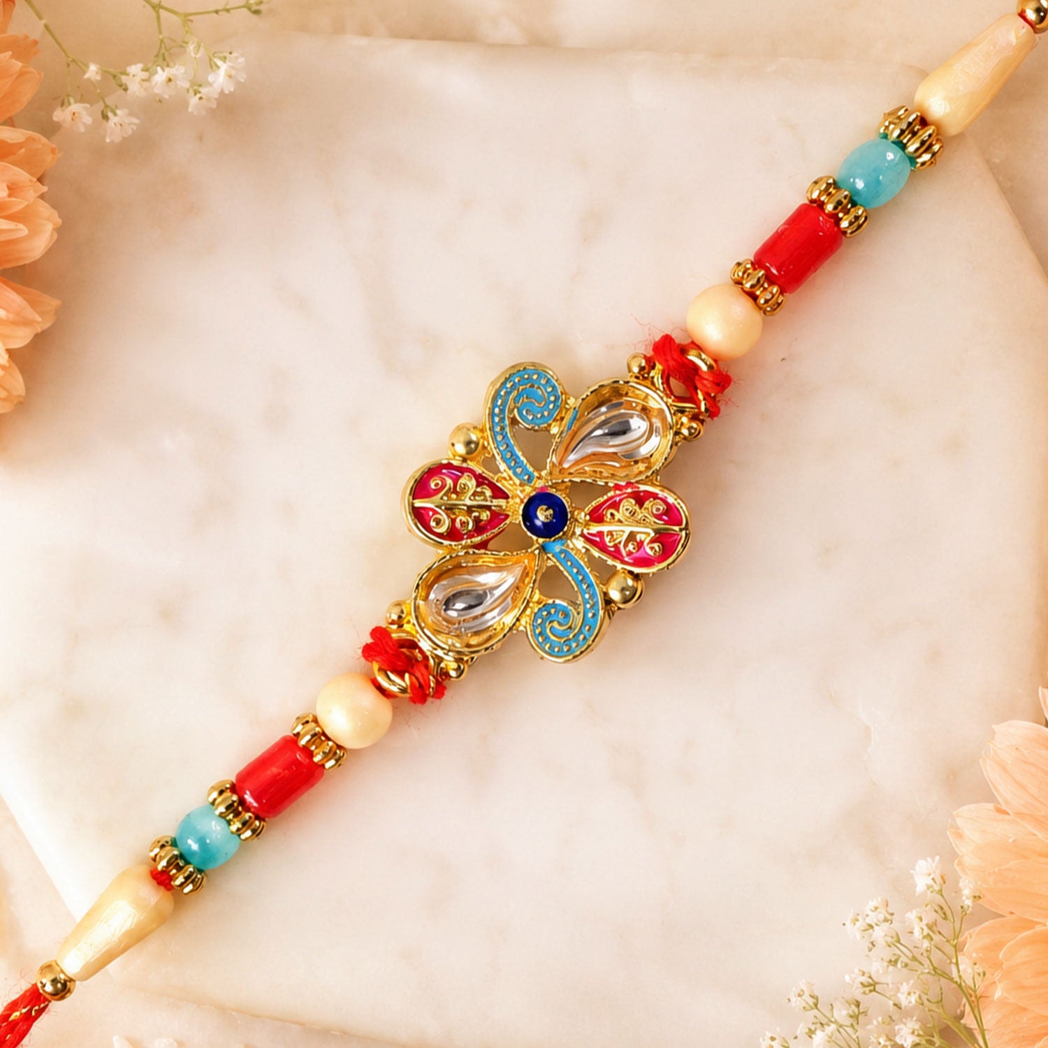 Jewel Floral Rakhi with Red Blue Beads and Bright Traditional Celebration Styling