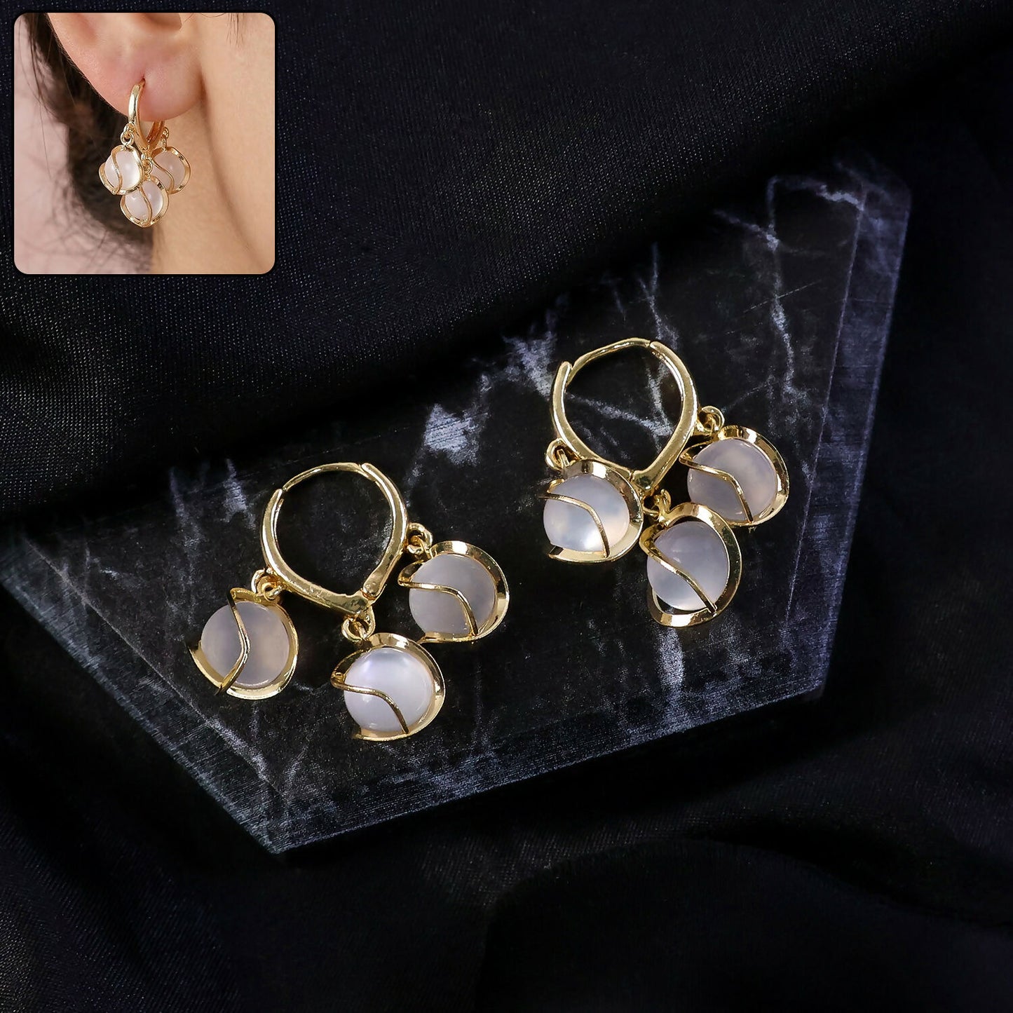 Gold-plated hoop earrings with opal stone clusters