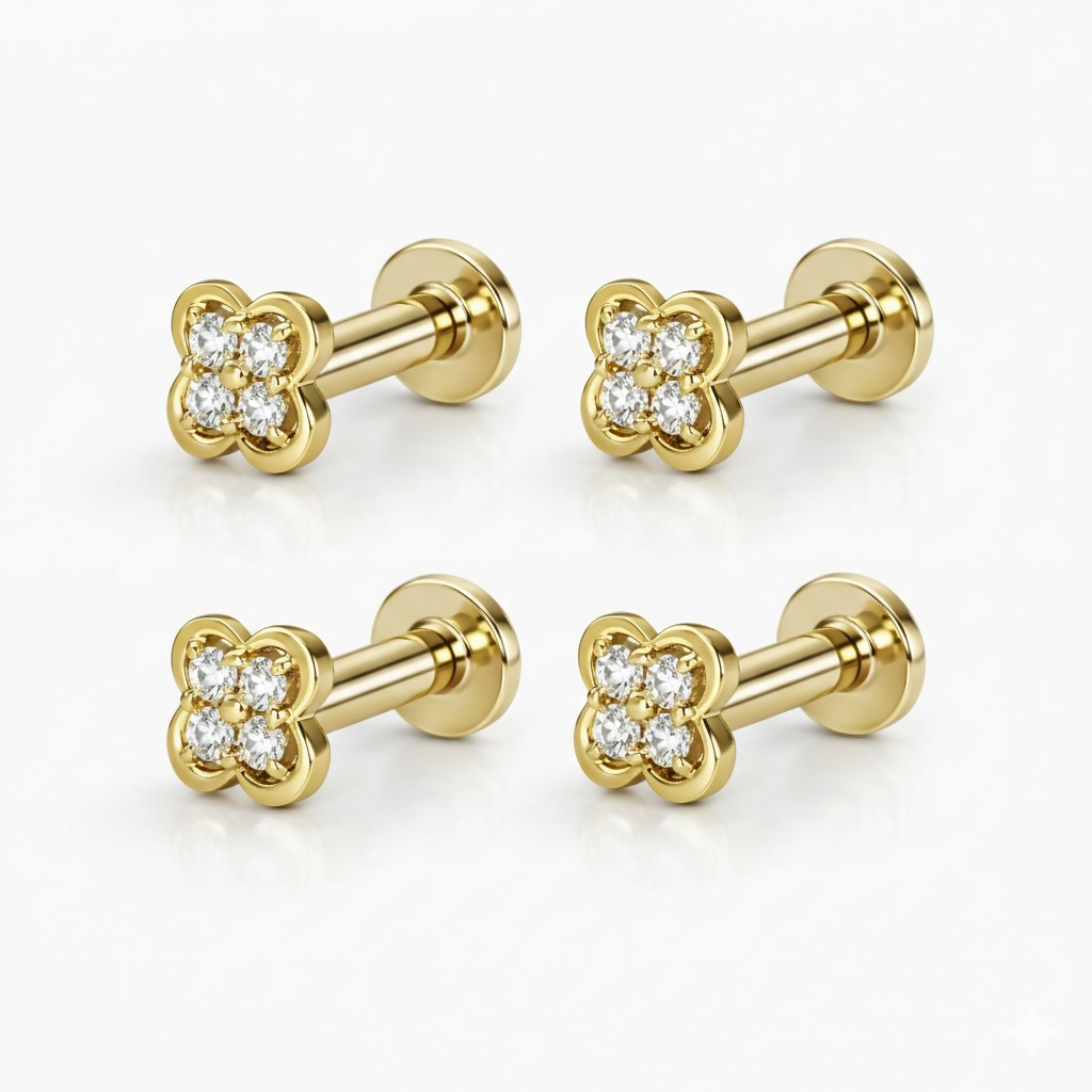 Two pairs of gold plated clover stud earrings featuring a shiny polished finish