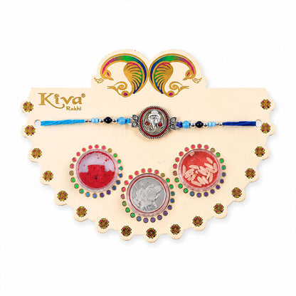 Round Ganesha Medallion Rakhi with Blue Thread, Roli Chawal Coin and Peacock Card Packing