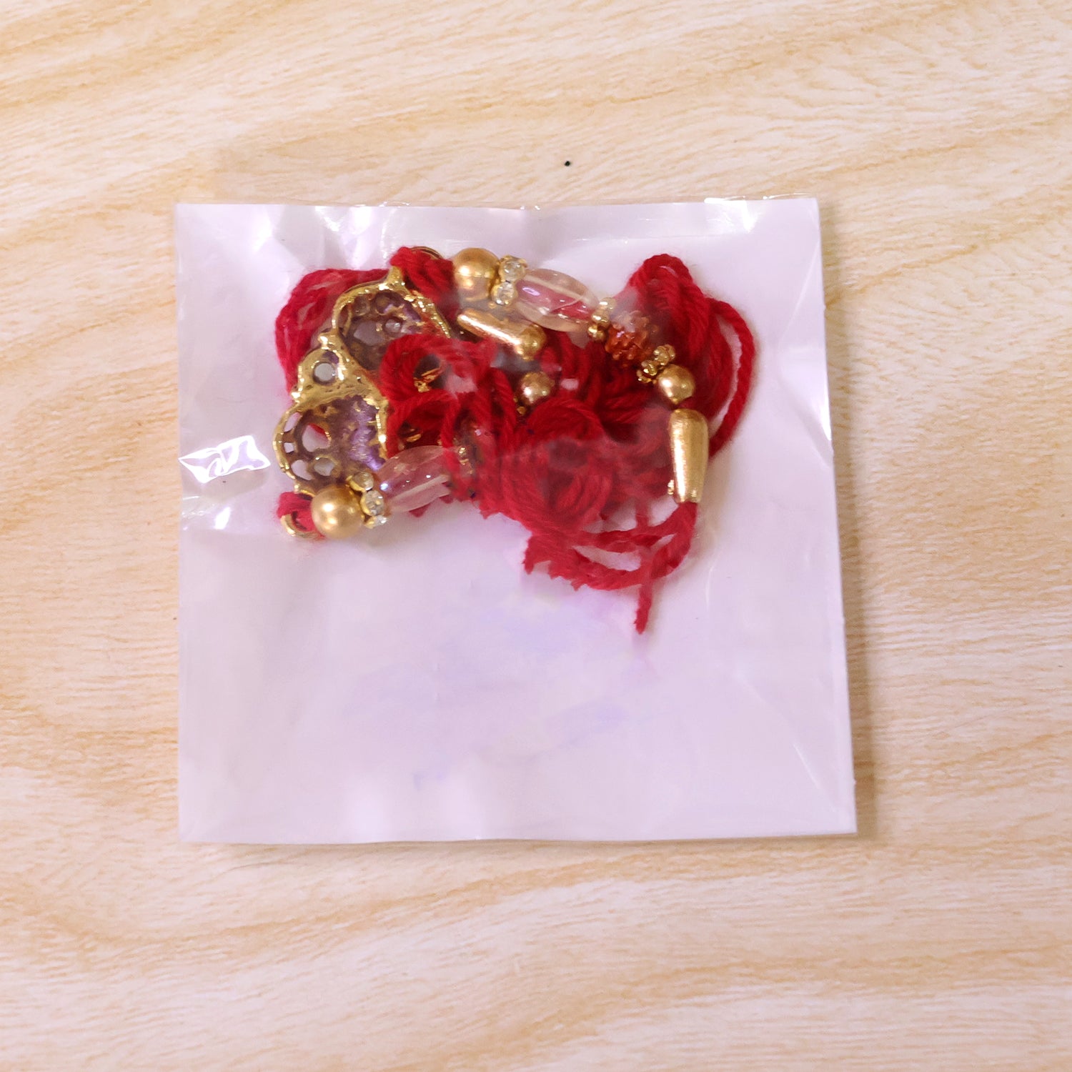 Oxidized Gold Paisley Medallion Rakhi with Rudraksha and Pearl Beads