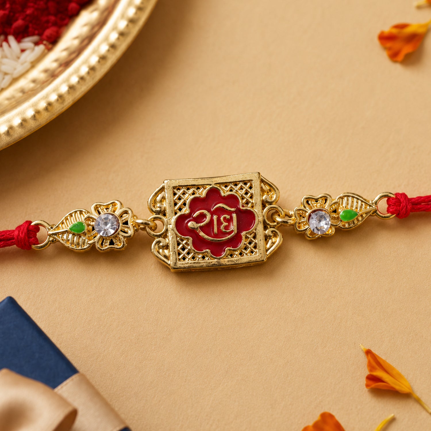 Gold-Toned Radhe with Red Enamel, Crystal Accents & Red Thread