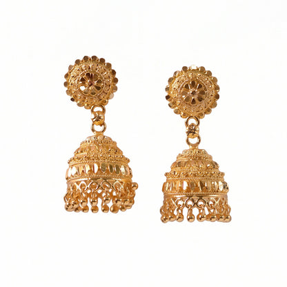 Front angle of gold jhumka earrings with pearl accents