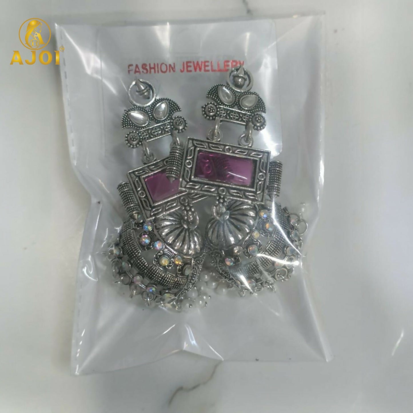 Royal Heirloom Oxidized Silver Jhumka Earrings with Blush Pink Stone, Intricate Hand-Engraved Motifs, Crystal Accents & Pearl Drop Fringe.