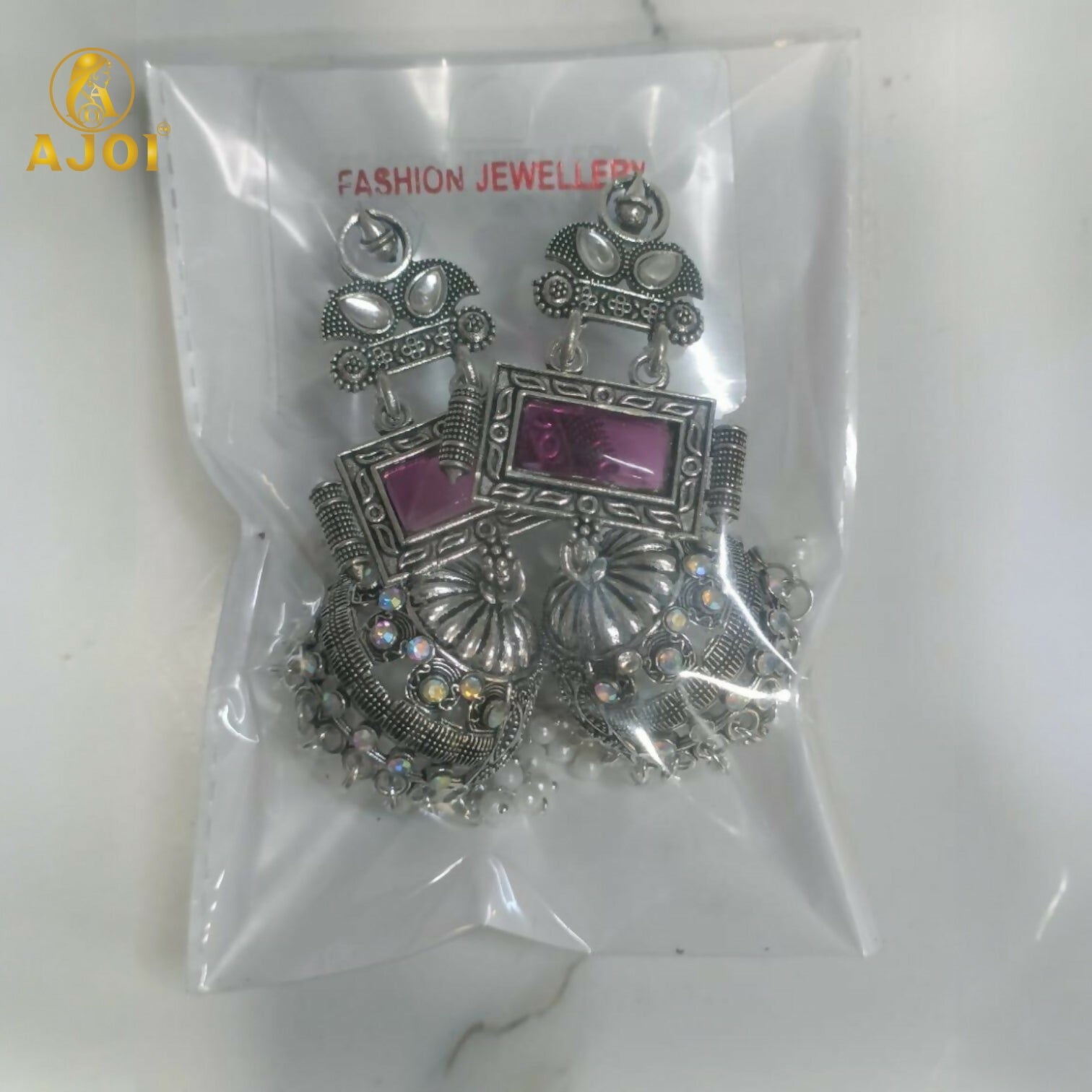 Royal Heirloom Oxidized Silver Jhumka Earrings with Blush Pink Stone, Intricate Hand-Engraved Motifs, Crystal Accents & Pearl Drop Fringe.