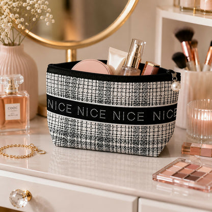 Portable cosmetic pouch with textured fabric and zipper