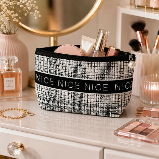 Portable cosmetic pouch with textured fabric and zipper