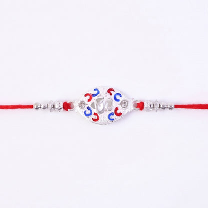 Silver Om Rakhi for Boys with Red Thread and Colorful Accents