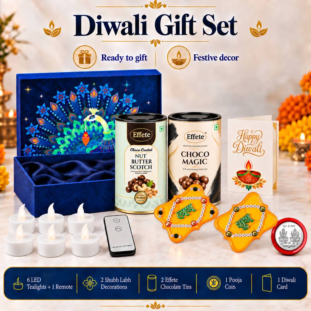 A complete Diwali gift set with a blue box, chocolate tins, LED tealights, a remote, yellow Shubh Labh decor, a silver coin,
