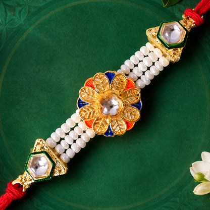 Pearl Flower Rakhi with Blue Yellow Details and Elegant Festive Brother Gift Styling