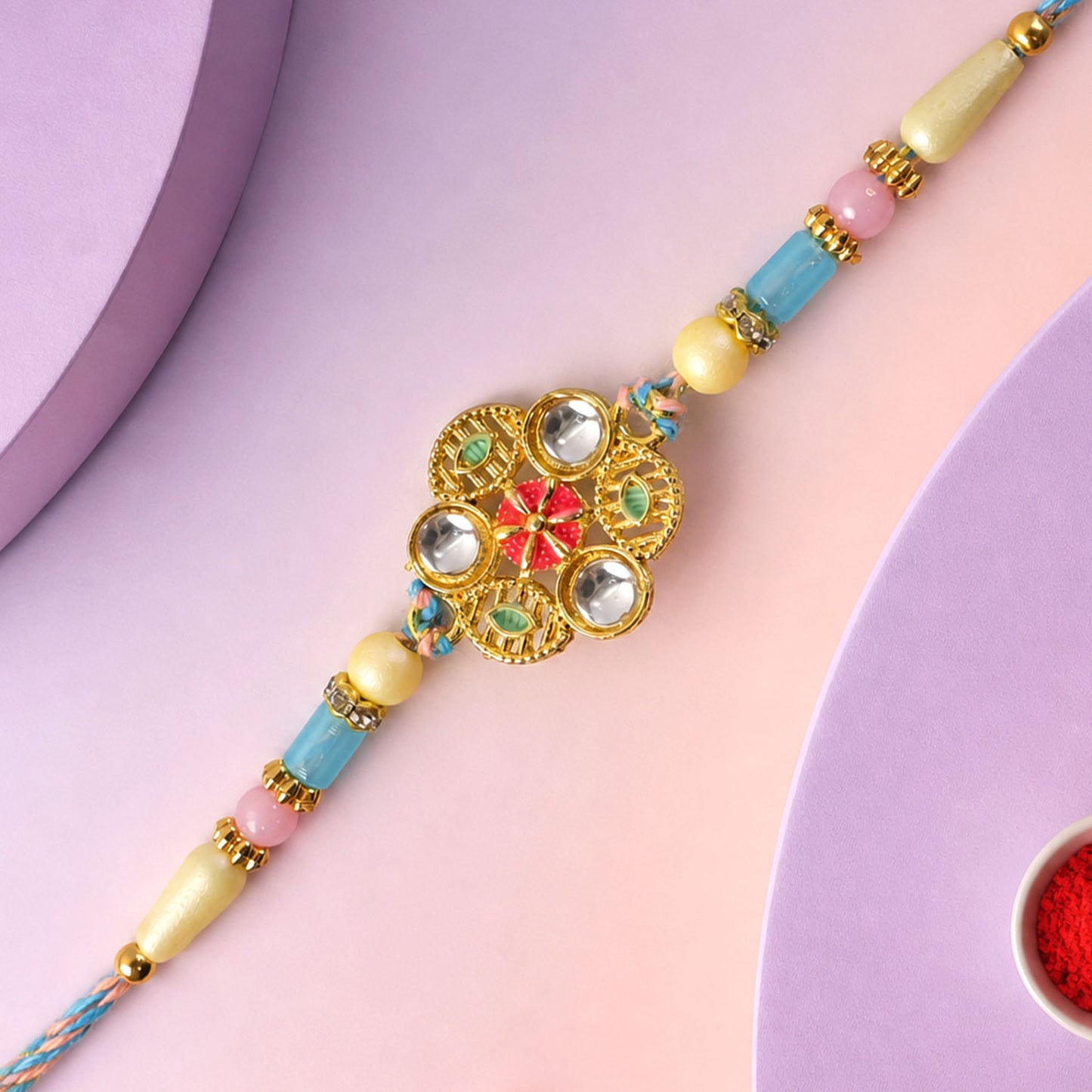 Blue Pink Floral Rakhi with Gold Medallion and Soft Festive Brother Gift Styling