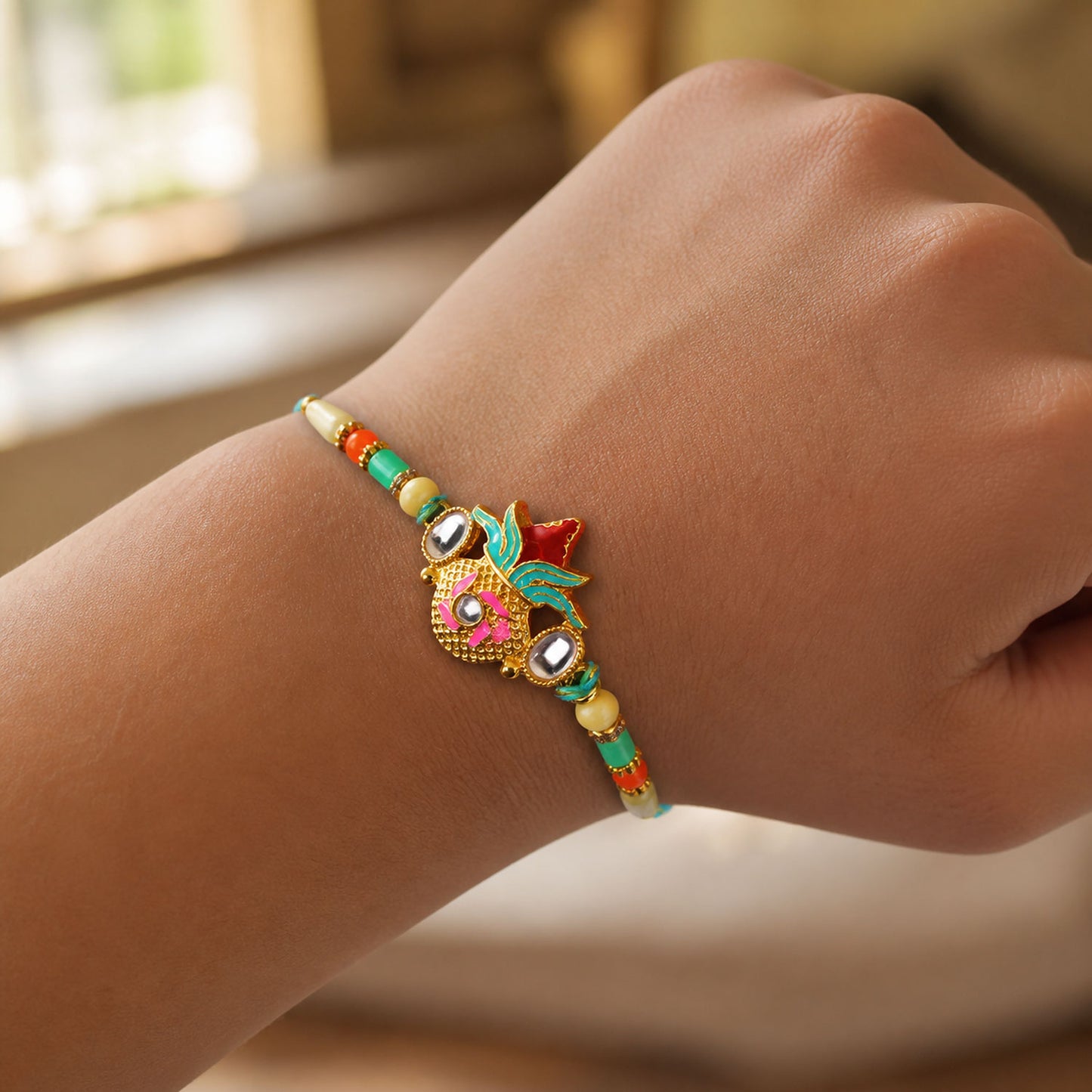 Sacred Nariyal Kalash Golden Metallic Motif Rakhi with Sea Green & Coral Beads