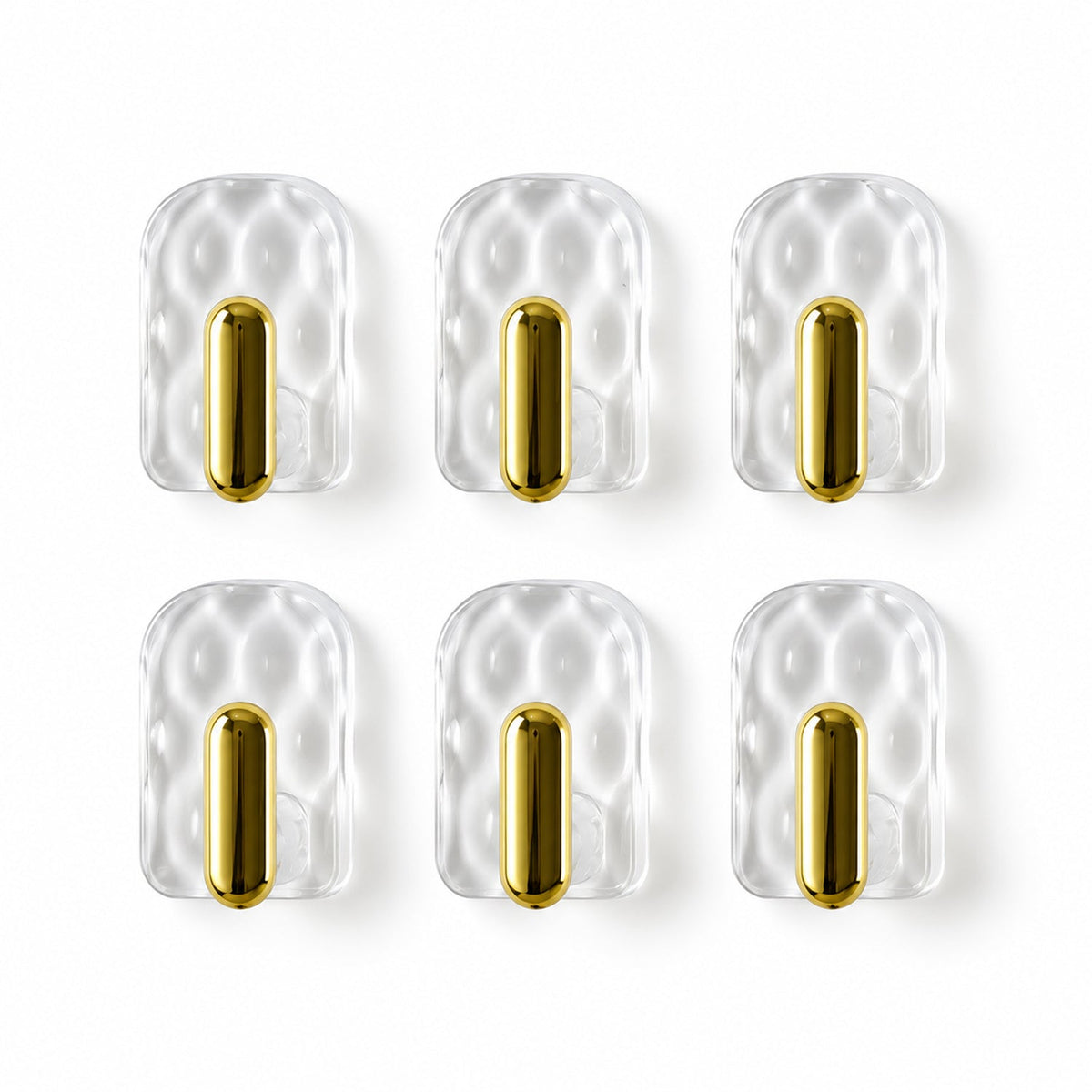 Six individual clear plastic hooks with gold accents arranged in two rows against a plain white background.