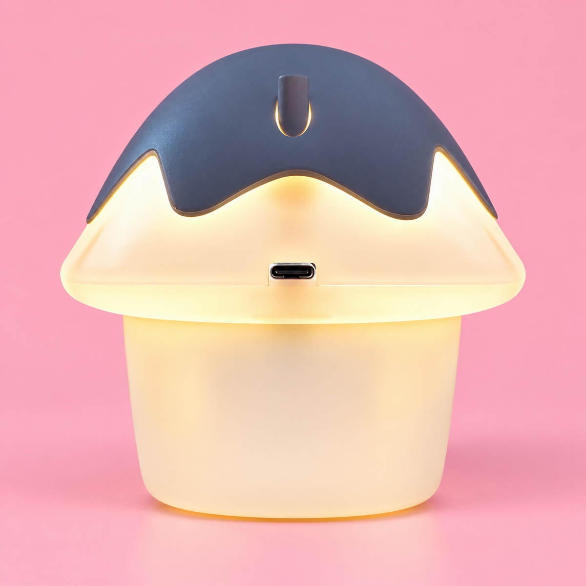 Rear view of the mushroom house lamp showing a dark grey cap with a power button and a USB-C charging port.