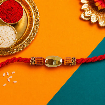 Red Thread Rakhi with Golden Oval Bead and Wooden Bead Accents