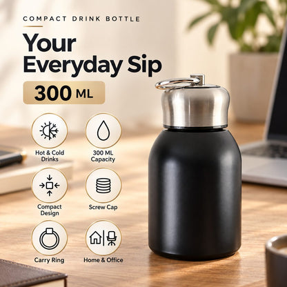 A black vacuum bottle with a silver cap on a wooden desk, surrounded by icons detailing its features like capacity and