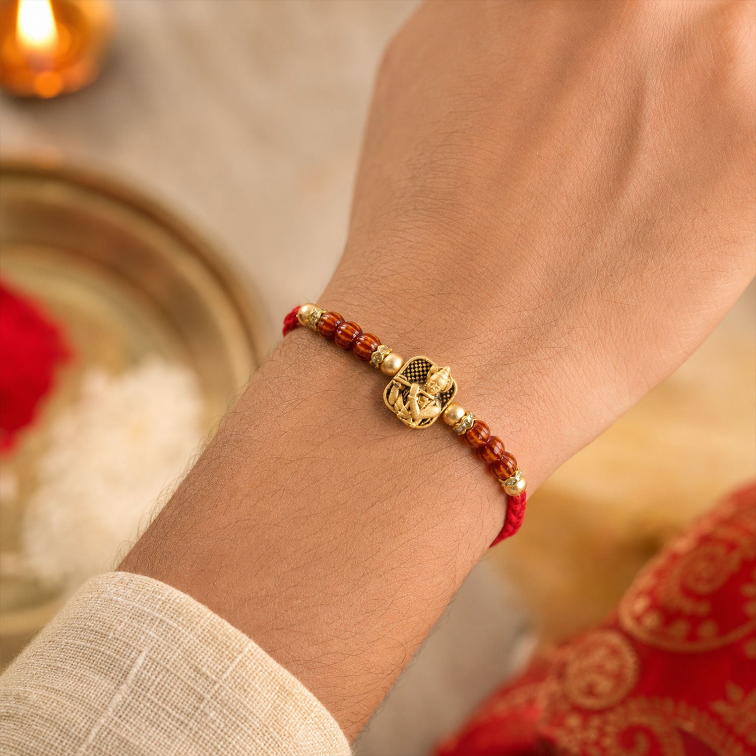 Red Beaded Rakhi with Antique Gold Krishna Charm and Wooden Beads