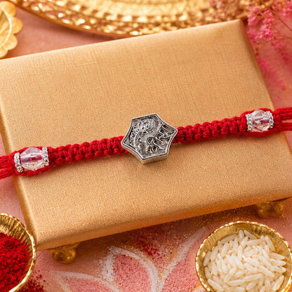 Red Thread Rakhi with Engraved Silver Shield-Shaped Charm Pendant